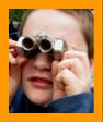 Young Boy looking Through Binoculars