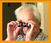 Older Man Enjoying Miniature Binoculars