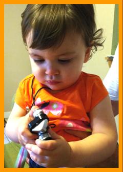 child looking at binoculars.
