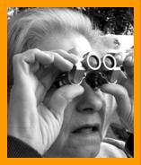 Woman watch whales with binoculars