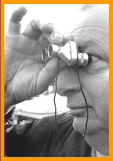 Man looking through binoculars