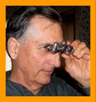 Man Using Pocket Binoculars