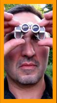 Man Viewing With Tiny Binoculars.
Man nusing binoculars.
Homme utilisant de jumelles.
Mann  mit fernglas.
Hombre usando binoculares.
Hombre usand prismaticos.
man som anvander kikare.
Uomo usa il binocolo.
Man met verrekijker.
Mezczyzna a lornetka.
Muz s dalekohled.
Mand med kikkert.
Tavcsovel rendelkezo ferfi.
Mies jolla on kiikarit.
Mulher com binoculos.
Virietis ar binokli.
Vyras su ziuronu.