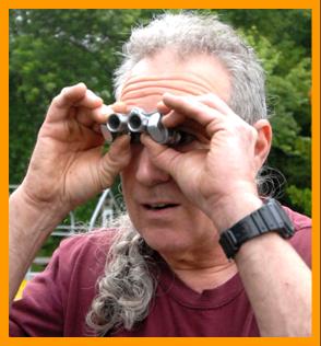 Long Haired Man with Tiny Binoculars