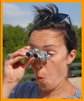 Shocked Woman Looking Through Binociulars