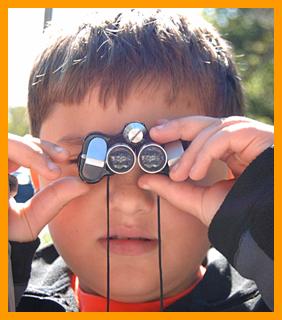 Child Using Miniature binoculars.
Boy using binoculars.
Boy with binoculars.
Garcon avec des jumelles.
junge mit fernglas.
Chico con binoculares.
Chico con prismaticos.
Pojke med kikare.
Raazzo con il binocolo.
Jongen met verrekijker. 
Gutt med kikkert.
Chlopiec z lornetka.
Chlapec s dalekohled.
Dreng med kikkert.
Fiu tavcsovel.
Poika kiikarin kanssa.
Menino com binoculos.
Zens ar binokli.
Berniukas su ziuronu.
