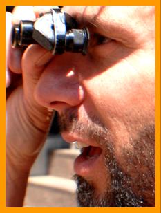 Bearded Man Using Small Binoculars. 
Man using binoculars.
Man with binoculars.
Homme utilisant ses jumelles.
Man mit seinem fernglas.
Hombre usando sus binoculares.
Hombre usando sus prisnmaticos.
Uomo che usa il suo binocolo. 
Man avander sin kikare.
Man die zijn verrekijker gebruikt.
Durbununu kullananadam.
Ember hasznalja a tavcsovet.
Mezczyznz uzwajacy lornetki.
Man, de bruger sin kikkert.
Mies kiikareillaan.
Muz pomoci sveho dalekohkedu.