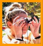 Woman Viewing with Miniature Binoculars.
Woman looking through binoculars. 
Woman using binoculars.
Femme utilisant de jumelles.
Frau mit fernglas.
Mujer usando binoculares.
Kvinna som anvander kikare.
Donna che usa il binocolo.
Vrouw met verrekijker.
Kvinne som bruker kikkert.
Kobiete za pomoca lornetki.
Muz pouzvajici dalekohled.
Kvinde de burger en kikkert.
No hasznal.tavcsovet.
Nainen kayttaa kiikareita.
Mulher usando binoculos.
Sieviete kas izmando binokli.
Moteris besinaudojanti ziuronais. 
